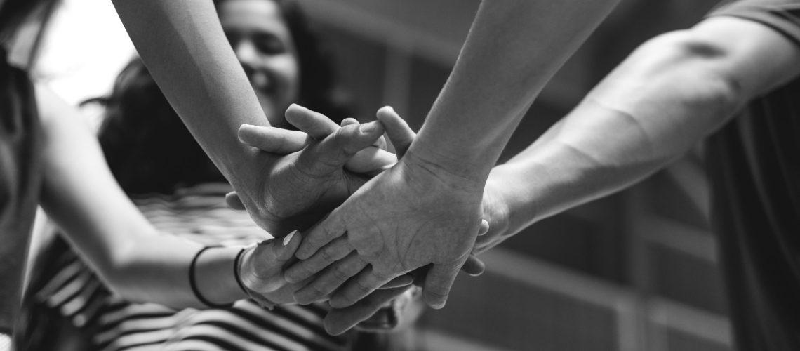 Group of teenager friends on a basketball court teamwork and togetherness concept